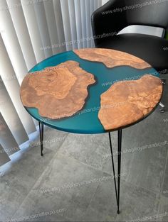 a table that has been made to look like wood and is sitting in front of a window