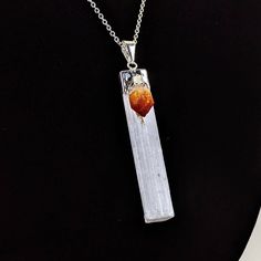 "Origin: Brazil Material: Selenite, Citrine, electroplate. Pendant Length (Approx): 2 inches Gorgeous hand-crafted white Selenite & Citrine point necklace! 24\" adjustable to 26\" brass silver-plated chain included! Citrine cleanses the chakras and attracts wealth, prosperity and success. It imparts joy, wonder, delight and enthusiasm as well as raises self-esteem and self-confidence. Selenite is used for good luck and protection. The powerful vibration of Selenite can clear, open, and activ White Spiritual Jewelry With Large Pendant, White Gemstone Amulet Jewelry, White Amulet Style Jewelry With Gemstone, Spiritual White Nickel-free Jewelry, Spiritual Nickel-free White Jewelry, Nickel-free White Spiritual Jewelry, White Citrine Jewelry As A Gift, White Citrine Jewelry Gift, White Citrine Jewelry For Gift