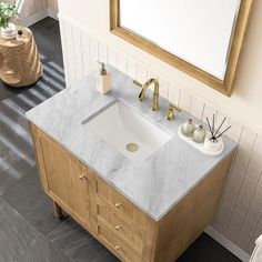 a bathroom with a sink and mirror in it