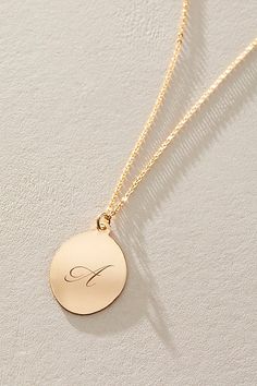 Just as effortless as it is elegant, this stunning necklace features an oval pendant with gorgeous cursive engraved initial for the ideal finishing touch. * 14k Gold Filled chain * Personalized, laser engraved, 14k Gold Filled 17x22mm oval pendant * Length: 20" * 5 days of production | Set & Stones Personalized Amelia Necklace at Free People in Gold Classic Oval Engraved Necklaces, Classic Oval Engraved Necklace, Elegant Oval Charm Necklaces For Anniversary, Elegant Oval Pendant Charm Necklaces For Anniversary, Elegant 14k Gold Charm Necklace With Oval Pendant, Elegant 14k Gold Oval Pendant Charm Necklaces, Elegant Personalized Initial Necklace For Formal Occasions, Elegant 14k Gold Oval Pendant Charm Necklace, Oval Engraved 14k Gold Necklace