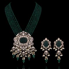 A pure masterpiece of glitz, grace, and elegance - perfect to enhance your festive attire! Make a statement and ethereal impression with an alluring ensemble embellished with CZ and carved stones, vintage bead work, pearl moti detailing and elephant motifs adding a festive charm to uplift your look. The set includes a mala and a pair of matching earrings. Approximate mala length is 12" & earrings length is 3.5". Gold-plated on high-quality brass as base metal. Aarti Set (White) is in-stock & rea Kundan Sets With Intricate Design For Diwali, Festive Kundan Set With Intricate Design, Intricate Design Sets For Diwali Reception, Intricate Design Sets For Reception At Diwali, Elegant Kundan Sets With Intricate Design, Elegant Anarkali Set With Pearl Embroidery For Festive Occasions, Elegant Festive Anarkali Set With Pearl Embroidery, Intricate Design Sets For Reception With Traditional Drape, Elegant Festive Sets With Intricate Design