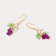 Introducing our Grape Earrings, the perfect addition to your summer jewelry collection. Experience the sweetness of summer with these juicy fruit earrings, featuring a lovely and refreshing design. The exquisite enamel finish adds an elegant touch to any style and exudes joy and personality. Elevate your look with these earrings that embody the spirit of summer. DETAILS Plating: 18K Gold Materials: 18K Gold on Brass, Enamel, Cubic Zirconia Size: 1.97 "*0.79"(5c m*2cm) Weight: 9.8g Summer Pink Earrings With Fruit Design, Summer Pink Fruit Design Earrings, Cute Fruit Design Drop Earrings, Summer Fruit Design Drop Earrings, Summer Fruit Design Earrings, Gold Fruit Design Drop Earrings, Trendy Dangle Earrings With Fruit Design, Gold Drop Earrings With Fruit Design, Trendy Fruit Design Drop Earrings