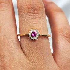 14K Solid Gold Birth Flower Ruby Ring 🌹 Celebrate Birthdays with the 14K Solid Gold Birth Flower Ruby Ring 🌹 🌟 Product Features: ⚖️ Weight: 1.45 Grams 🌈 Material Colors: Available in Yellow Gold, Rose Gold, and White Gold 🎁 Presentation: Shipped with a special box and bag, perfect for gifting 🔄 Returns: Right to return within 7 days ✨ Material and Color: Designed to never fade or darken 🛠️ Handcraftsmanship and Uniqueness: Handcrafted with love, may vary by 5% (+-) The 14K Solid Gold Birth Flower Ruby Ring is a beautiful way to celebrate your birth month. Featuring a stunning ruby and available in three exquisite shades--yellow gold, rose gold, and white gold--this ring offers versatile elegance for any style. Each ring is meticulously handcrafted, ensuring a unique piece that refle Flower Shaped Rings With Accent Stones For Anniversary, Fine Jewelry Flower Cluster Ring With Gemstone, Fine Jewelry Flower Ring With Accent Stones, Flower-shaped Rings With Accent Stones For Anniversary, Fine Jewelry Flower Ring For Proposal, Flower-shaped Anniversary Rings With Accent Stones, Fine Jewelry Floral Rings With Accent Stones, Cluster Flower Promise Ring In Fine Jewelry, Elegant Birthstone Cluster Rings