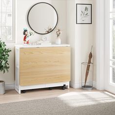 a white and wood dresser with a mirror above it in a room that is decorated with potted plants