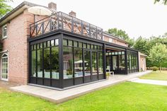 a large house with glass walls and windows