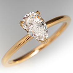 This bright solitaire style ring contains one (1) pear brilliant cut diamond weighing 0.84 carats set into a three-prong setting. The ring measures 8.1mm at the top, rises 6.0mm above the finger, tapering to 1.4mm wide and 1.4mm thick at the base of the shank. It is currently sized to a 6 5/8. Gia Certified Pear-shaped Diamond Promise Ring, Gia Certified Pear Diamond Ring, Timeless Pear-shaped Diamond Ring With Vvs Clarity, Fine Jewelry Pear-shaped Single Diamond Ring, Gia Certified Pear-shaped Diamond Ring, Pear-shaped Single Diamond Ring, Classic Pear-shaped Diamond Ring, Gia Certified Teardrop Diamond Ring For Anniversary, Timeless Pear-shaped Diamond Anniversary Ring