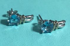 "BEAUTIFUL 10K WHITE GOLD BLUE TOPAZ DIAMOND EARRINGS! Beautiful earrings in 10K gold! Round blue topaz stones each measuring 6mm with 1 pt round diamonds. Earrings measure approximately 1/2\" long. Weight is 2.3 grams Gently used beautiful I am liquidating my huge jewelry collection, this lovely pair of earrings needs a new owner : )" Blue Topaz Stone, Topaz Stone, 10k Gold, Blue Topaz, Sapphire Ring, Beautiful Earrings, Round Diamonds, Turquoise Bracelet, Topaz