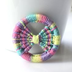 a coffee cup with a crocheted ring on it