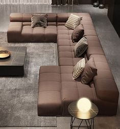 a living room filled with lots of brown furniture