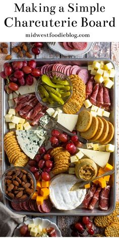 an assortment of cheeses, crackers, and meats on a platter