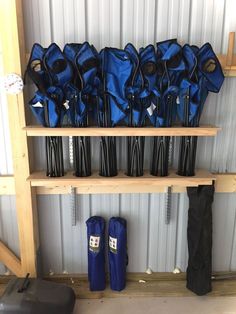 there are many blue umbrellas on the shelf