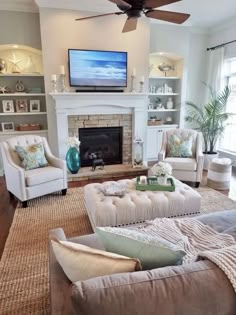 a living room filled with furniture and a flat screen tv mounted above a fire place