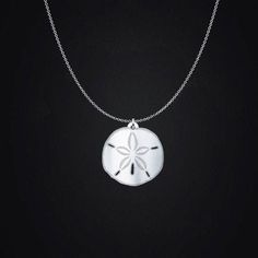 This sterling silver sand dollar necklace is a beautiful reminder of the ocean waves and summer days at the beach all year long.  General Information: It has an incredible shine that you will love every time that you look at it. Charm comes in four sizes: - 3/4in (20mm) - 1in (24mm) - 1.18in (30mm - 1.5in (38mm) Chains come in two lengths: - 18in (45cm) - 20in (50cm) Charms are a sturdy and thick .036in (0.9mm), 20 gauge sterling silver. Chains are a .047in 45.00(1.2mm) thickness Italian sterlin Sterling Silver Pendant Jewelry For Beach, Silver Strand Shell Necklace For Beach, Nickel Free White Necklace For Beach, Nickel-free White Necklace For Beach, Beachy Silver Strand Jewelry, Ocean-inspired Sterling Silver Beach Jewelry, Ocean Color Pendant Jewelry For Beach, Silver Beachy Jewelry For Beach Occasions, Beachy Silver Beach Jewelry