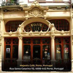 an old building with red doors and ornate carvings on the front door, in portugal