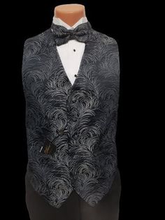 TUXXMAN Bill Blass Black and Silver Feather vest and Bow tie! REAL POCKETS Full back! So you don't see your shirt when you take off the coat!  You are buying the  Vest and Bow tie Adjustable waistband  These are not the cheap really thin material ones! That droops after one wearing or cleaning Questions? Always feel free. Larry TUXXMAN Silver Tuxedo, Tuxedo With Tails, Silver Bow Tie, Mens Formal Vest, Feather Vest, Vest And Bow Tie, Morning Coat, Formal Vest, Tuxedo Vest