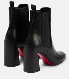 Find CHRISTIAN LOUBOUTIN Leather Ankle Boots on Editorialist. Lining: leather. Comes with dust bag. Toe shape: round toe. Sole: leather insole, signature red leather sole. Upper: leather. Comes with a box. Made in Italy. Closure: elasticated sides. Black Boot Heels, Red Bottom Boots, Louboutin Online, Red Bottom, Louboutin Heels, High Shoes