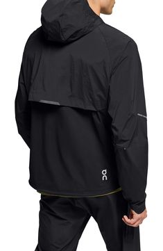 Enjoy the versatility of a lightweight, wind-resistant running jacket designed with a stay-put hood and secure zip pockets. 28 1/2" length (size Medium) Front zip pockets Drawstring hood Partial elastic cuffs with top extension On-seam zip pockets Drawstring hem Packs into pocket Reflective details enhance visibility in low light or at night Lined 87% Recycled polyamide 13% elastane Machine wash, tumble dry Imported Clothing Labels Design, Casual Cargo Pants, Hooded Jacket Men, Outdoor Jacket, Running Jacket, Designer Clothes For Men, Clothing Labels, Jacket Design, Outdoor Wear