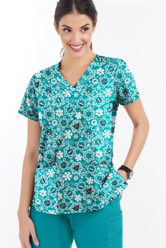 Our rounded V-neck is both flattering and functional. The Butter-Soft Original scrub collection delivers you the durability you demand and the comfort you deserve in our signature lightly brushed easy-care fabric. Snowflakes? Smiling? Why not! Smiles are always welcome – and a little whimsy helps the shift fly by. • Classic fit • Rounded V-neck • 4 front pockets • Short sleeve • Back darts • Side vents • Approximate length for size M is 27 1 2 Feathery light and so silky, our Soft Stretch fabric Fabric Snowflakes, Nursing Scrubs Pattern, Scrub Collection, Scrubs Pattern, Holiday Scrubs, Wonderwink Scrubs, Pink Scrubs, The Shift, Scrubs Nursing