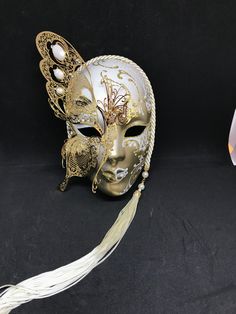 Venetian Mask for decoration - Traditional and original papier-mache Venetian mask, handmade and decorated with metal insert, gold-leaf and glitters,enriched with Swarovski crystals. Dimension::Hight 31cm,width 24cm Decoration only,not wereable All our masks are handmade papier-machè masks made in Venice. Our decorators use techniques typical of the Venetian tradition such as stucco, acrylics, gold and silver-leaf, macramè, passementerie, glitters and crequelè to offer you a wide range of origin Gold Full Face Masks For Carnival, Gold Full Face Masks And Prosthetics For Carnival, Gold Full-face Masks And Prosthetics For Carnival, Full Face Gold Masquerade Mask For Carnival, Gold Full Face Masquerade Mask For Carnival, Artistic Gold Masks For Costume Party, Gold Masquerade Mask For Theater And Carnival, Gold Masks For Evening Carnival, Gold Masks And Prosthetics For Carnival Evening