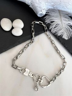 "Massive box chain Swarovski padlock necklace, luxurious antique silver heart push gate necklace, bold square chain locket crystal pendant Welcome to my shop! PLEASE KINDLY NOTE: THE LISTING IS FOR ONE NECKLACE!! Chunky box chain necklace made of a sturdy and thick stainless steel metal, and is completed with a padlock and key, a unique heart gate clasp, and an original Swarovski crystal! All silver pieces are subjected to an anti-allergic process (nickel and lead-free). MEASUREMENTS: I make thi Gift White Gold Chunky Chain Necklace, Chunky Chain White Gold Necklace As Gift, White Gold Chunky Chain Necklace Gift, Silver Heart Pendant Chain Necklace With Chunky Chain, Silver Chain Necklace With Lock, Everyday Silver Lock Jewelry, Silver Metal Necklace With Lock Detail, Silver Chunky Chain Necklace Gift, Silver Box Chain Necklace With Square Pendant