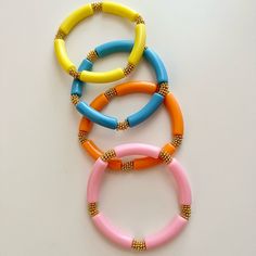 These Bangles Are The Perfect Spring/Summer Vibe. Wear Altogether Or Pair Separately For The Aesthetic You’re Going For. These Bangles Are Stretchy And 7”. Size Adjustments Can Be Made If Needed! Fun Yellow Beaded Bracelets For Summer, Playful Blue Beaded Bracelets For Summer, Fun Yellow Beaded Bracelet For Summer, Playful Orange Bracelets For Beach, Fun Beach Bracelets For Spring, Trendy Orange Bracelets For Vacation, Bohemian Orange Bracelets For Summer, Yellow Beaded Bracelets For Summer, Orange Bohemian Bracelets For Summer