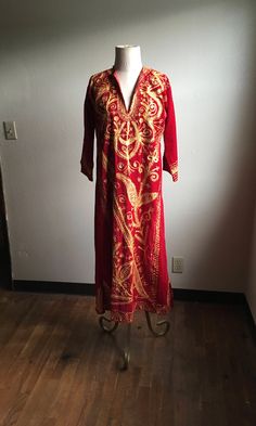 "1970s handmade kaftan shirt dress red velvet gold color brocade w/silver accenting thread deep v pullover 3/4 sleeve ankle length, depending on wearer's height 7\" side slits good vintage condition, light wear no size tag, one size fits most, see below measures, lying flat, shoulder-17\" sleeve-17\" chest-21 1/2\" waist-19\" hip-23\" length-51\"" Fitted Long Sleeve Kaftan With Gold Embroidery, Festive Bohemian Kaftan With Gold Embroidery, Bohemian Kaftan With Gold Embroidery For Festive Occasions, Fitted Tunic Kaftan For Festive Occasions, Bohemian Thobe With Gold Embroidery For Festive Occasions, Bohemian Festive Thobe With Gold Embroidery, Bohemian Kaftan With Gold Embroidery For Festivals, Festive Bohemian Thobe With Gold Embroidery, Fitted Long Sleeve Bollywood Kaftan