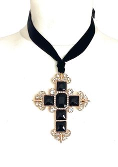 Black cross statement choker from Olivia Divine. Over-sized, black jewelled cross pendant. Set on a black velvet ribbon. Ties at the back, so can be worn as a choker or at a longr5 length. Cross 9 cm x 7 cm approx. Handmade deisgn. Black Cross Choker Necklace, Black Cross Choker As Gift, Adjustable Black Cross Choker, Gothic Cross Pendant Jewelry For Party, Elegant Cross Choker As A Gift, Cross Choker For Party, Adjustable Cross Jewelry For Party, Black Cross Choker For Party, Black Cross Pendant Necklaces For Party