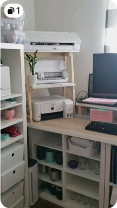 a computer and printer sitting on top of a desk