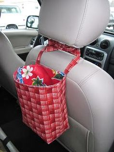 a red basket in the back seat of a car