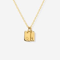 Embrace timeless elegance with this chic initial tag charm, a versatile piece designed to add a personal touch to any ensemble. Featuring a sleek, rectangular silhouette with a subtly embossed initial, this charm crafted from lustrous material is perfect for personalizing your favorite chain, bracelet, or accessory. Ideal for layering or as a standalone statement, this charm is a stylish way to keep a special initial close to your heart. Charm size: 10 mm x 5 mm Made of 14K gold over sterling si Silver Rectangular Initial Necklace, Elegant Silver Rectangular Initial Necklace, Classic Rectangular Jewelry For Personalized Gifts, Rectangular Monogram Jewelry For Anniversary, Rectangular Charm Necklaces For Everyday, Elegant Rectangular Initial Necklace For Personalized Gift, Elegant Personalized Rectangular Initial Necklace, Elegant Rectangular Initial Engraved Necklace, Elegant Engraved Rectangular Initial Necklace