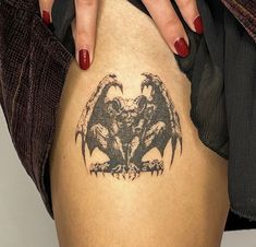 a woman's leg with a tattoo on it