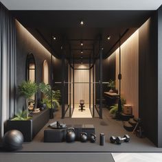 an empty room with black furniture and plants