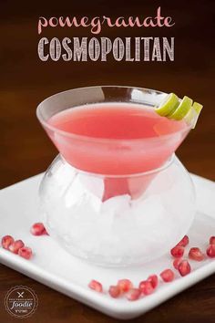 pomegranate and cosmopolian cocktail in a bowl with garnish