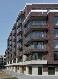 an apartment building with many balconies and windows