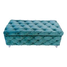 an upholstered blue ottoman with metal legs and buttons on the top, sitting in front of a white background