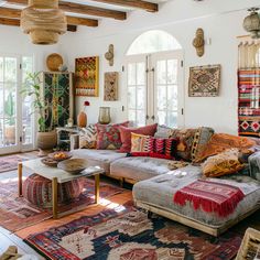 a living room filled with lots of furniture and rugs