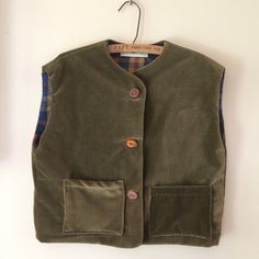 "Handmade vest is a cozy alternative to a sweater , a special layering piece. Soft brushed cotton lining, wooden buttons, handmade buttonholes. Made to last. Pass it on ! NB: irregular pockets, as shown. chest - 34 inches waist - 34\" armhole - 16\" shoulder to hem - 17 All fabrics and materials used have been sourced over time by me, around B.C. or on Vancouver Island. Assembled in my home studio in Qualicum Bay." Cotton Sweater Vest With Buttons For Fall, Fall Cotton Sweater Vest With Buttons, Cotton Vest With Buttons For Layering, Green Winter Vest With Buttons, Everyday Cotton Vest With Button Closure, Brown Cotton Vest With Buttons, Handmade Buttonholes, Clown Clothes, Handmade Vest