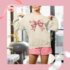 Introducing our charming Girly Sweatshirt! This cozy and chic sweatshirt embraces the coquette style with its adorable bow graphic, featuring a delicate pink bow accentuating its feminine charm. Created for the fashion-forward trendsetter, this Girly Sweatshirt is the perfect addition to your wardrobe. Made with premium materials, it ensures ultimate comfort while exuding a stylish flair. Whether you're running errands or meeting your friends for a coffee date, this coquette sweatshirt is sure to make a statement. Show off your love for all things girly and classically elegant with this must-have sweatshirt!  Ideal for any situation, a unisex heavy blend crewneck sweatshirt is pure comfort. These garments are made from polyester and cotton. This combination helps designs come out looking f Girly Sweatshirt, Coquette Sweatshirt, All Things Girly, Bow Graphic, Love Scriptures, Chic Sweatshirt, Coquette Style, My Sewing Room, Coffee Date