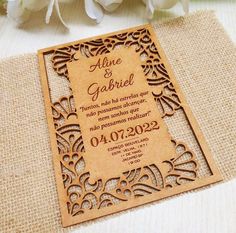 a wooden laser cut wedding card with an intricate design