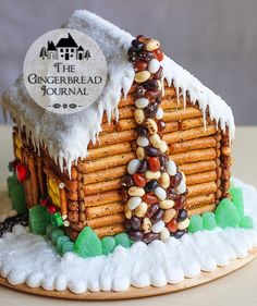 a gingerbread house made to look like it has been decorated with candy and nuts