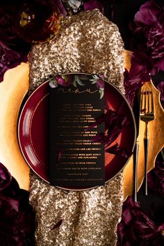 a plate with a menu on it next to purple flowers and gold sequins