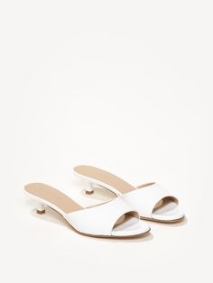 With its kitten heel and mesh or patent upper, The Serena packs all of the trends into one sophisticated sandal. It’s perfect for those summer soirées and travels. Simple Wedding Shoes Heels, Timeless Summer Shoes, White Heels Sandals, Small Wedge Heels, Low Platform Heels, Comfortable Kitten Heels, White Sandal, Sandals White, Summer Kitten Heels