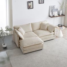 a living room with a sectional couch and white rug