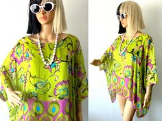 "♥ Y2k Flowy, lightweight, fluttery tunic style slouchy top by NT BY AMATI. ♥ Soft, stretch interior tank top and semi-sheer outer layer. ♥ Asymmetrical hem. ♥ Great bright lime green shade with teal, pink, black, yellow floral print. ♥ Lots of vacation vibes, great for resorts, beaches, poolside, summer parties! ♥ Fast FREE Shipping! ♥ Ask for a discount on bundles.  ♥ INSTAGRAM: franzialux_rellickroad MEASUREMENTS (FLAT)  * PIT TO PIT: 21\" (across)  Measured interior tank top. * TOTAL LENGTH: 25\"   - 35\" asymmetrical hem. *FIT / SIZE: Works great on a range of sizes! Small, Medium, Large and XL.-- (Shown on Betty 😇 a U.S. Size Small) *MATERIAL: Silk, Viscose *CONDITION: Excellent *BRAND:   NT by Amati PLEASE NOTE: All items are gently used to pristine. I hand-wash or gently cycle gar Bright Green Blouse, Colorful Blouse, Slouchy Top, Bohemian Top, Colorful Blouses, Resort Fashion, Vacation Vibes, Bohemian Tops, Loose Top