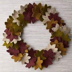 a wreath made out of leaves on a wall