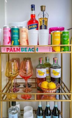 a bar cart filled with bottles and glasses