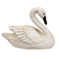 The Resin Carved Swan is a decorative swan bird figurine made of durable resin with a realistic carved and whittled texture with a natural wood grain. The swan has a distressed ivory finish and black painted beak and eyes. This swan brings a rustic touch to the home year-round, displaying freestanding on a riser, tray, shelf, or table. Measures 4.5” high by 6” wide by 3” deep. Swan Bird, Trumpeter Swan, Swan Figurine, Bird Figurine, Texture Paste, Dream House Rooms, Decorating With Pictures, Whittling, Black Paint