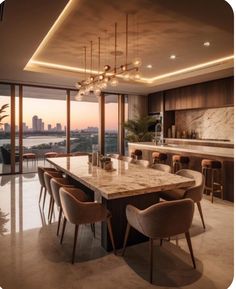 a dining room table and chairs in front of a large window with city lights on it