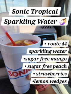 a person holding a drink in their hand with the words sonic tropical sparkling water on it