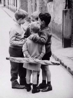 a group of young boys standing next to each other